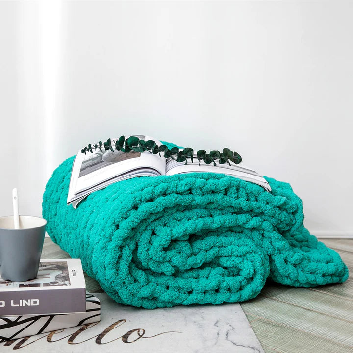 Cozy Chunky Knit Chenille Blanket in green, 80 X 100cm in a bedroom