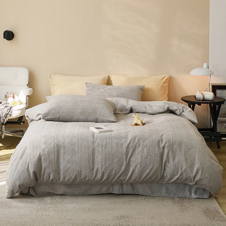 Twisted Warm Quilt Cover in gray, Queen in a bedroom