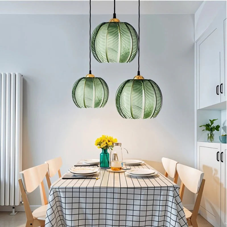 Leaf Pattern Glow Pendant Light above a dining table