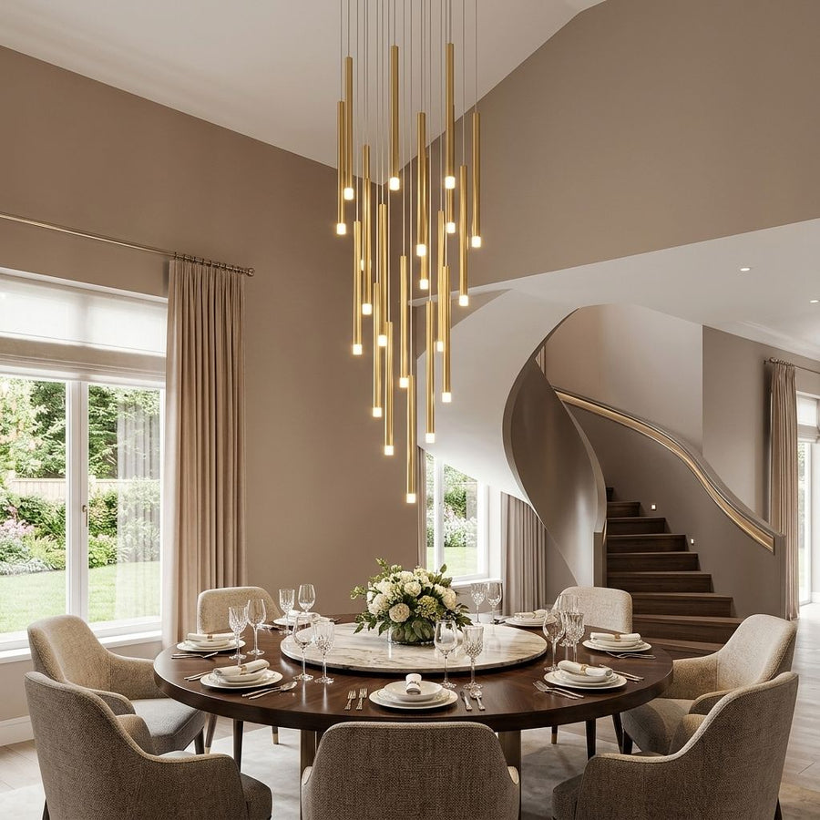 Brushed Gold Tube Pendant Staircase Chandelier above a dining table