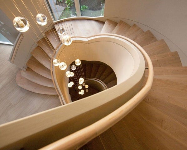 Cast Crystal Sphere Cascade Chandelier above a staircase