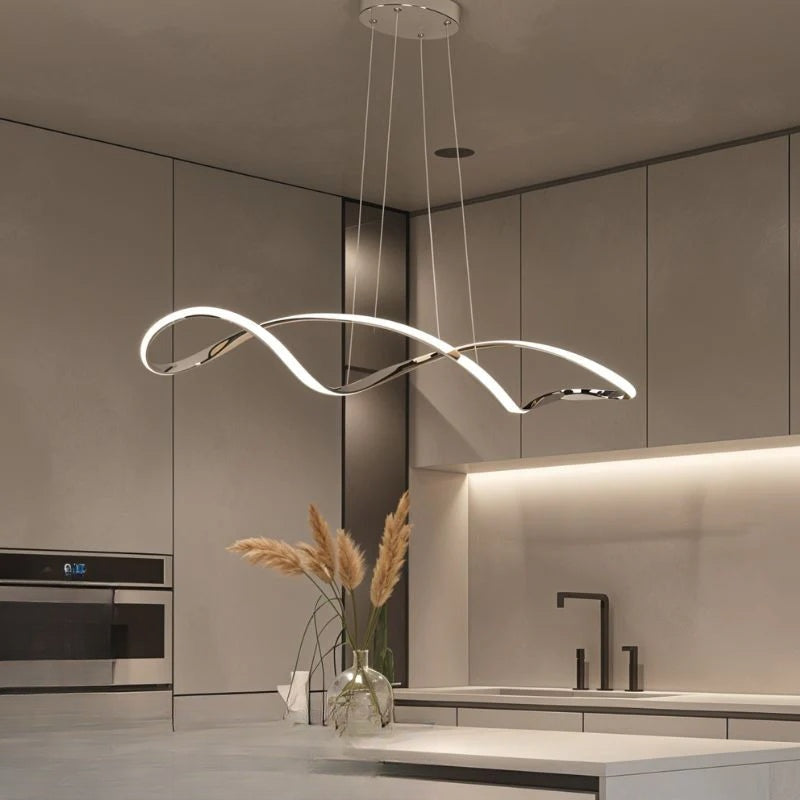 Elite Swirl Flourish Chandeliers over a kitchen island