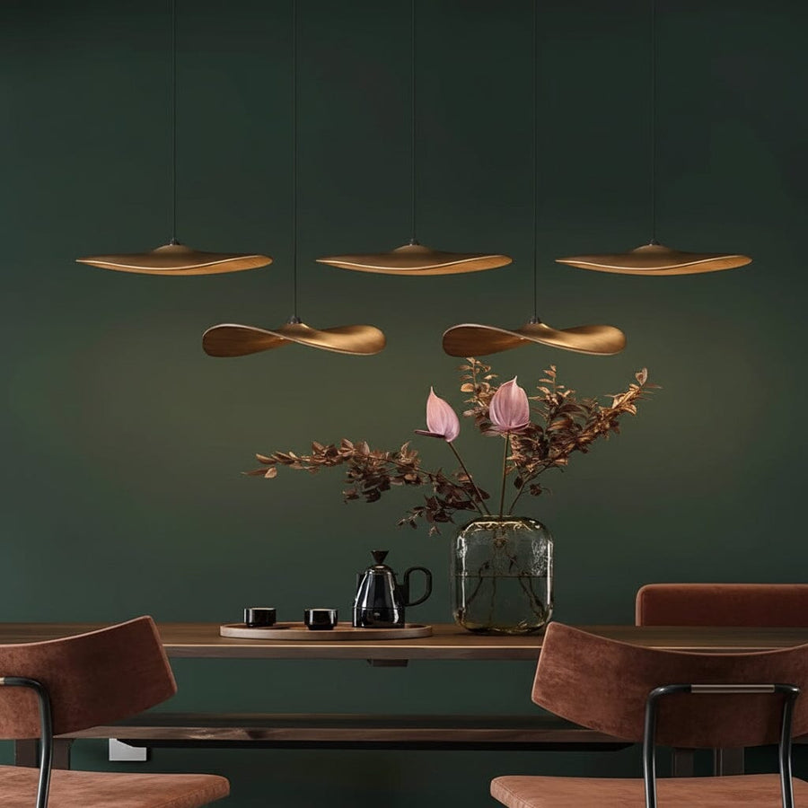 Curved Wood Disc Cloud Chandelier above a dining table