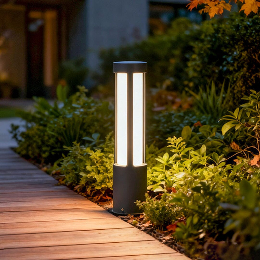 Cylindrical LED Bollard & Pole Light along a garden path