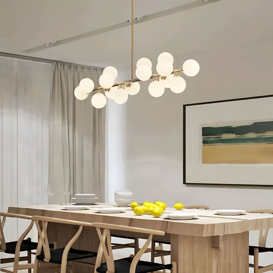 Frosted Glass Globe 16-Light Linear Flush Chandelier above a dining table