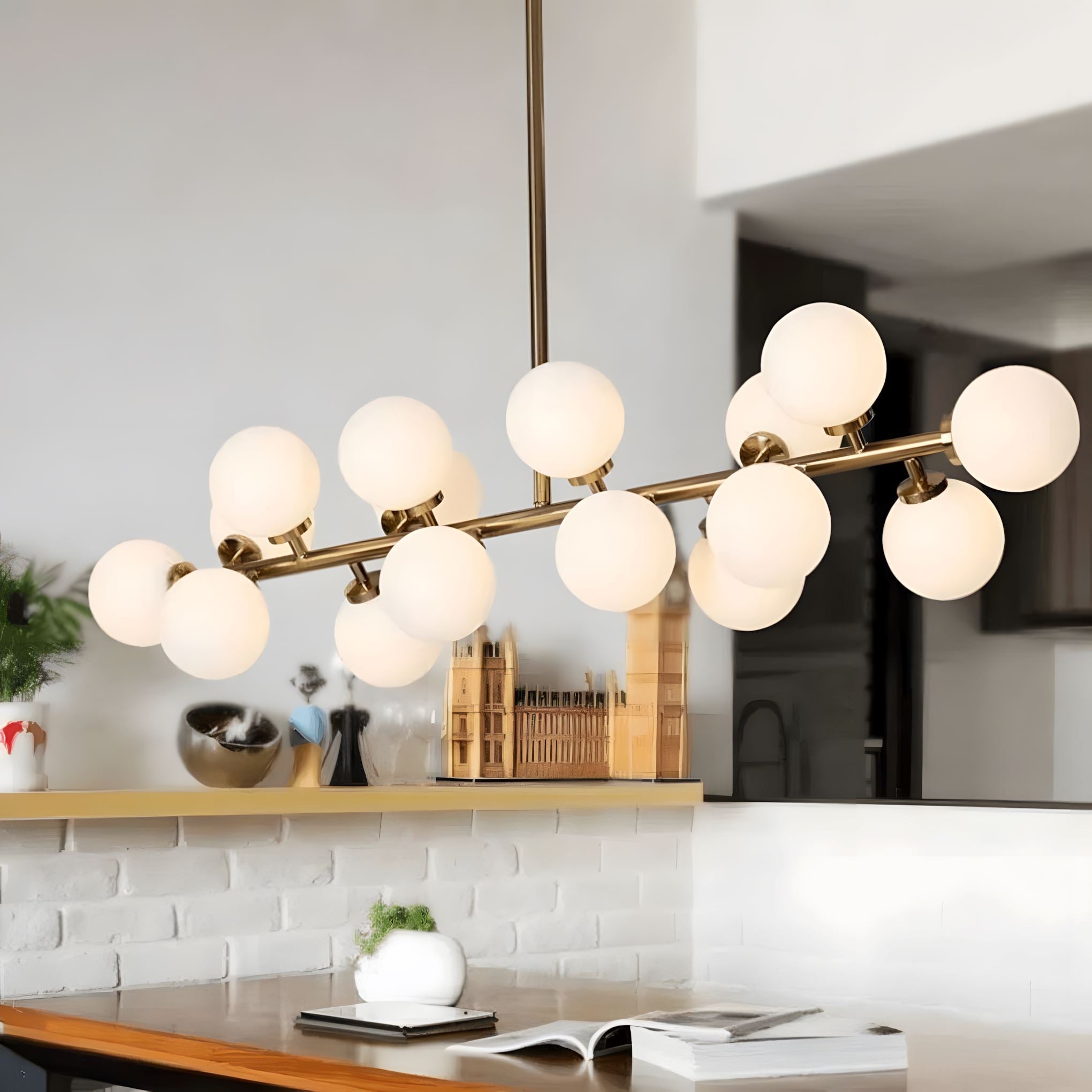Frosted Glass Globe 16-Light Linear Flush Chandelier over a kitchen island