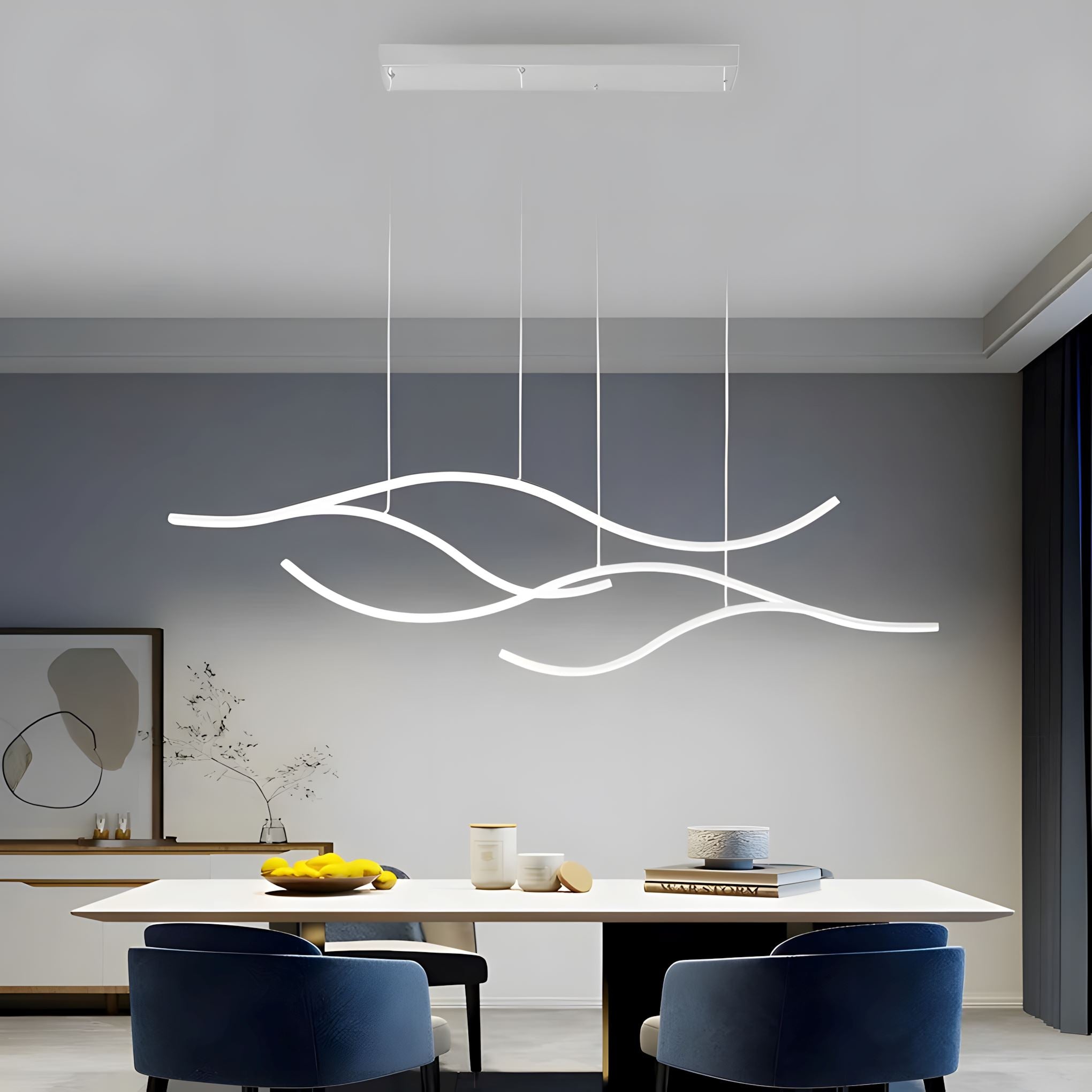 Gold Wave LED Linear Chandelier above a dining table