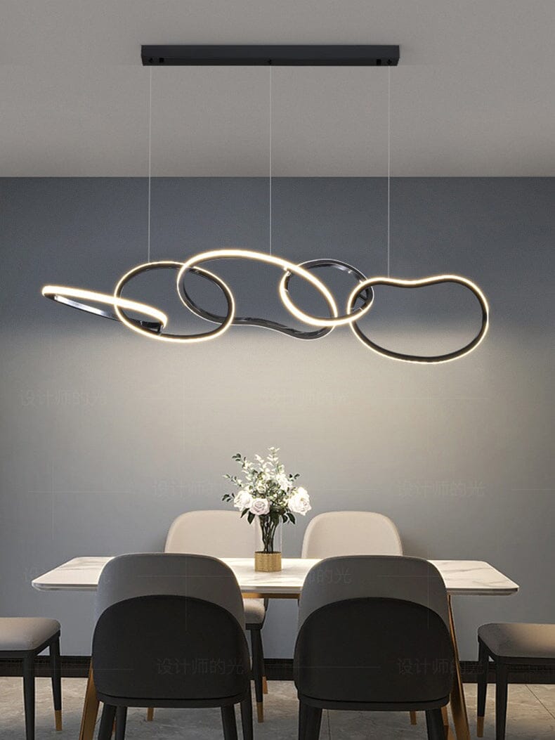 Interlinked Rings LED Linear Chandelier above a dining table