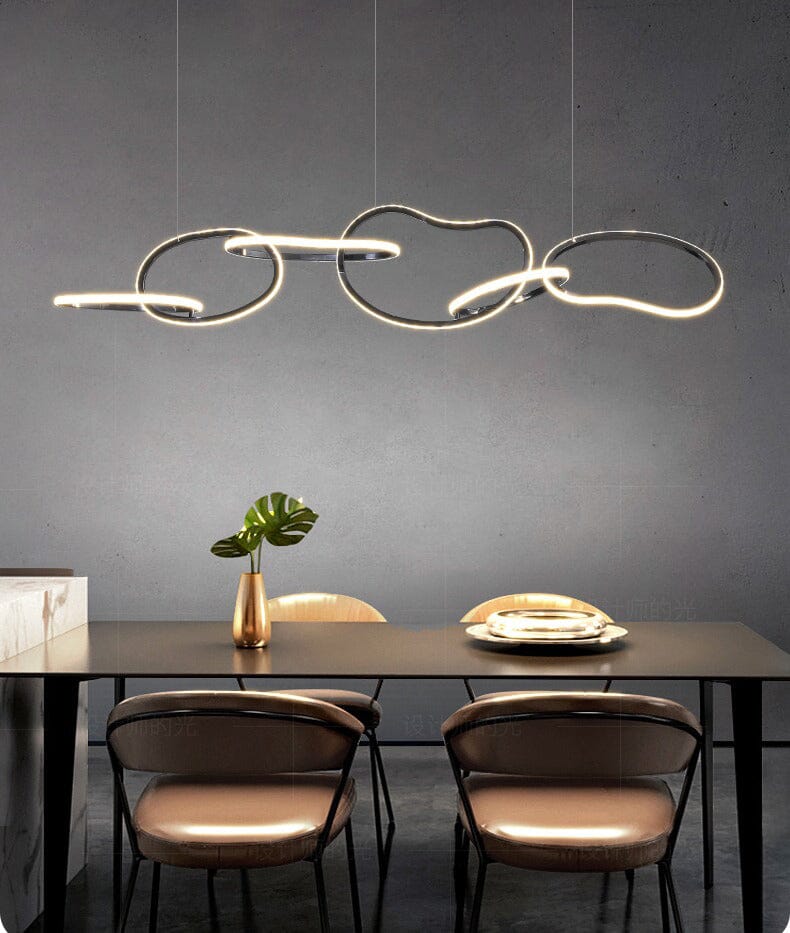 Interlinked Rings LED Linear Chandelier above a dining table