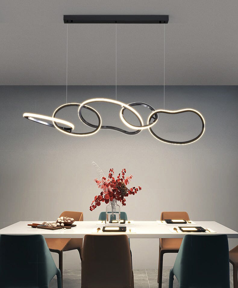 Interlinked Rings LED Linear Chandelier above a dining table