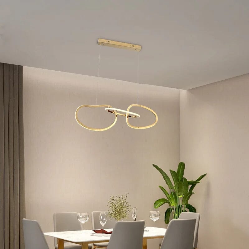 Interlinked Rings LED Linear Chandelier above a dining table