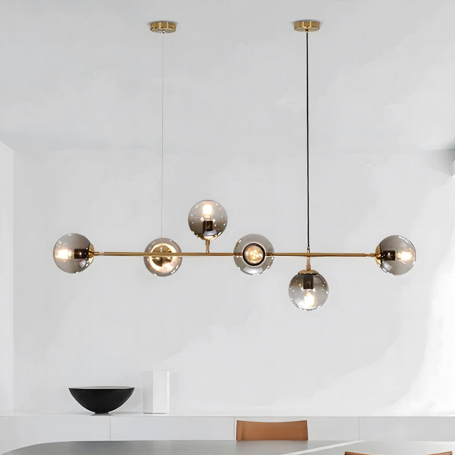 Loft Bubble Glass Linear Chandelier above a dining table