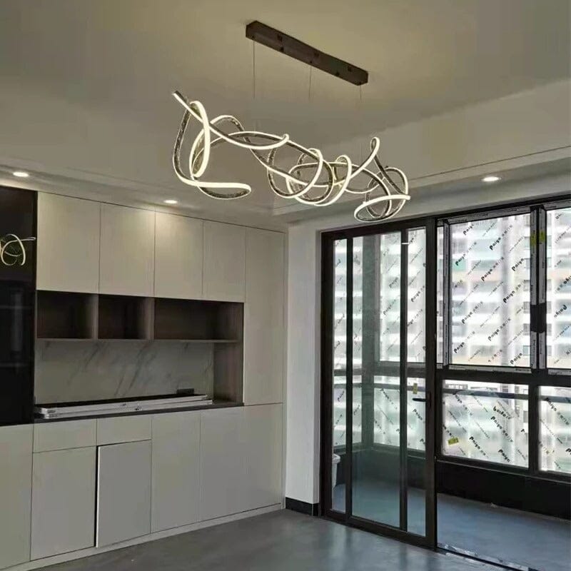 Twisted Swirl LED Linear Chandelier over a kitchen island