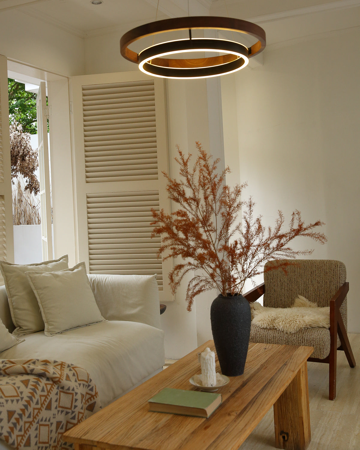 Wood and Acrylic Concentric Ring LED Chandelier in a living room